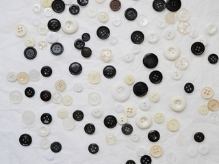 Background of multi-colored buttons. Abstract background. Pattern of buttons on a white background.