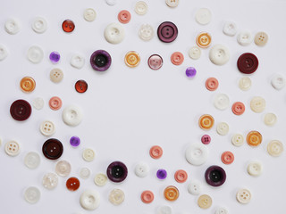 Background of multi-colored buttons. Abstract background. Pattern of buttons on a white background.
