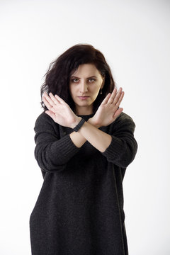 Woman showing crossed hands
