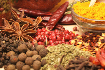 Various spices on wooden background.