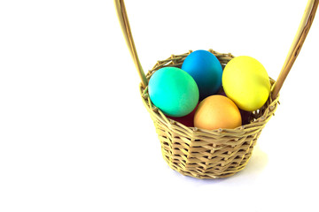 Basket with easter eggs  on a white background