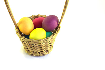 Basket with easter eggs  isolated on a white background