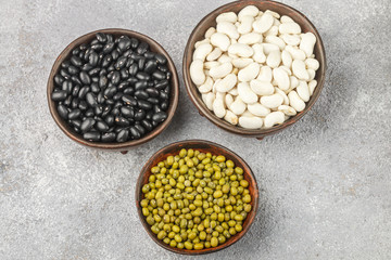Assortment of dry beans - white, black and green. Selective focus