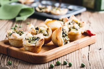 Homemade spinach and feta cheese puff pastry cups - Powered by Adobe