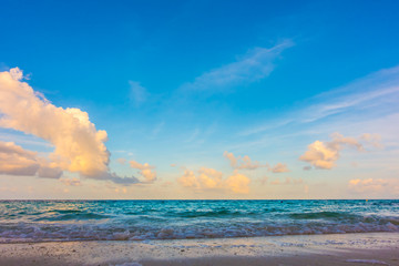 Beautiful sunrise with sky over calm sea  in tropical Maldives island .