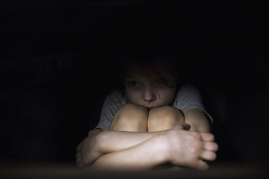 Frightened child in the dark