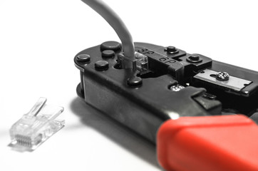 rj45 network crimper tool with red handles on white isolated background.