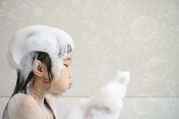 Little Asian girl take a bath