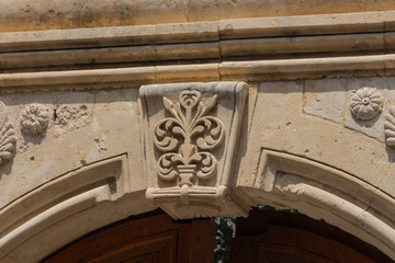 Rethymno, Greece - August  5, 2016:  Ancient bas-relief over archway.