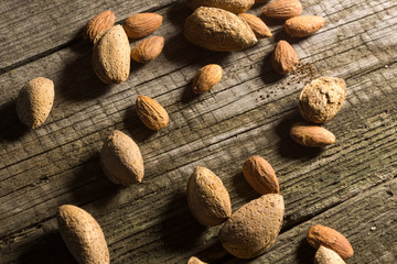 Top view of Almonds over rustic wooden background