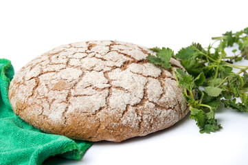 Rye bread loaf with nettle leaves