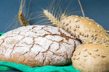Rye bread loaves and wheat plant
