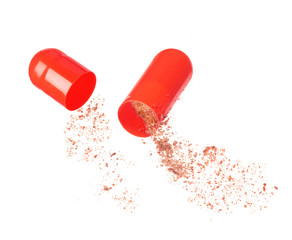 close up of open medical capsule isolated on white background