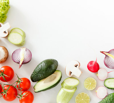 Fresh Green And Red Vegetables Lie On A White Background, Vegetarian Food.