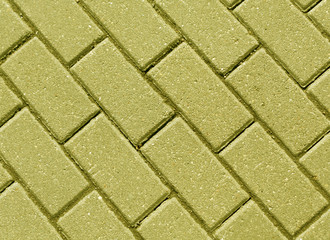 Yellow color cobblestone pavement close-up