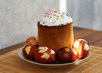 easter cake and easter eggs on the saucer