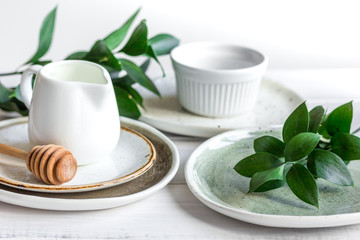 ceramic tableware with flowers on white background