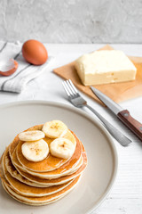 cooked pancake on plate at wooden background