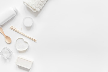 white set of cosmetics for spa on table background top view mockup