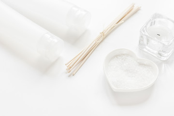body care concept with white set of cosmetics woman desk top view
