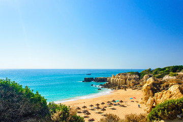 Fototapeta na wymiar beautiful sea view of sandy beach Pria do Castelo in Algarve