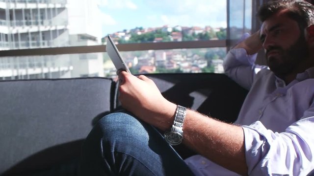 man using technlogy at modern apartment