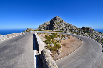 Famous hairpin curve on the road to the village of Sa Calobra on Mallorca, Spain - obrazy, fototapety, plakaty