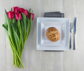 Red Tulips and Place Setting with Dinner Roll