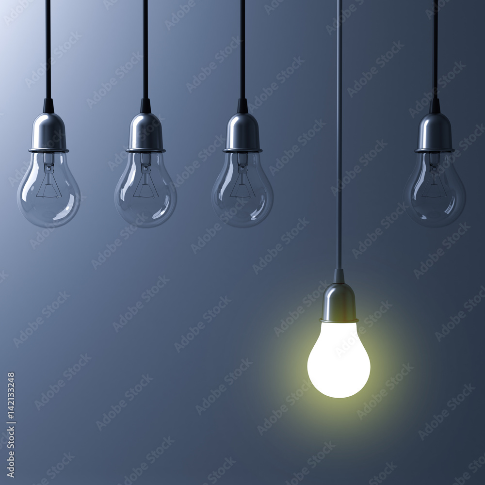 Fototapete One hanging light bulb glowing different and standing out from unlit incandescent bulbs with reflection on dark cyan background , leadership and different business creative idea concept. 3D rendering.