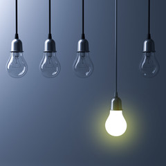 One hanging light bulb glowing different and standing out from unlit incandescent bulbs with reflection on dark cyan background , leadership and different business creative idea concept. 3D rendering. - obrazy, fototapety, plakaty