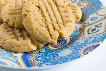 Homemade peanut butter cookies on colored plate