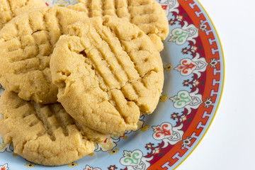 Homemade peanut butter cookies on colored plate
