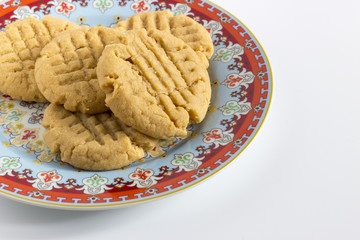 Homemade peanut butter cookies on colored plate