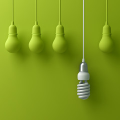 One hanging eco energy saving light bulb different and stand out from old incandescent lightbulbs on green background with shadow , individuality and different creative idea concept . 3D rendering.