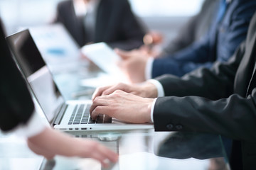Young businessman working with laptop at office