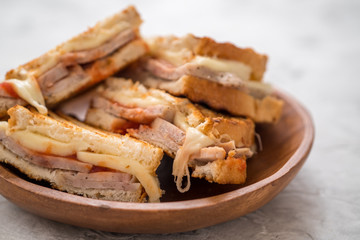 A grilled ham and swiss cheese sandwich