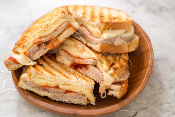 A grilled ham and swiss cheese sandwich