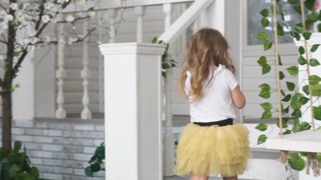 Girl model goes back to the house and the ladder