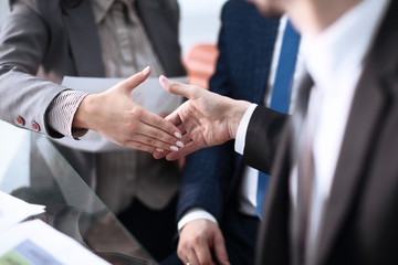 Close up view of business partnership handshake concept.Photo of two businessman handshaking process.Successful deal after great meeting