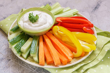 Platter of assorted fresh vegetables with dip