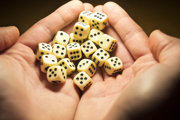 Man holds dice in hands
