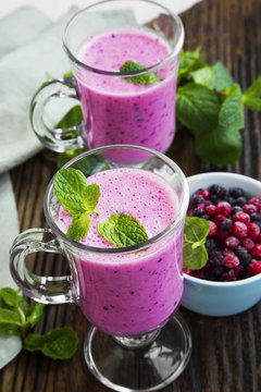 Berries smoothies glasses with fresh mint