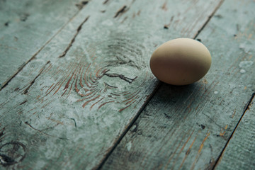 Farm eggs on wood vintage background.