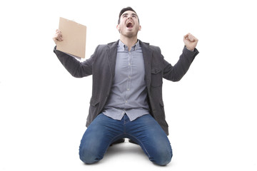 young man isolated celebrating with euphoria and enthusiasm