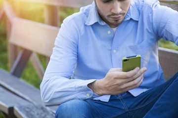young man casual hipster with mobile phone