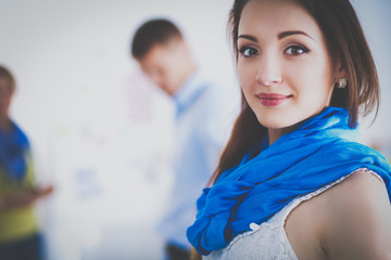 Portrait of attractive female designer in office