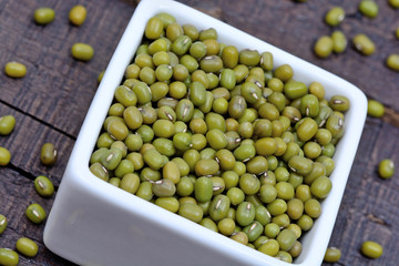 Mung beans in a ceramic bowl on table