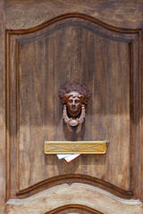 Mailbox in old door with the papers