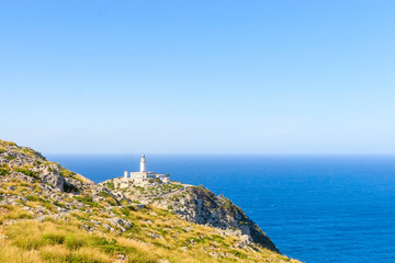 Fototapeta na wymiar Lighthouse at Cape Formentor in the Coast of North Mallorca near sea and horizont