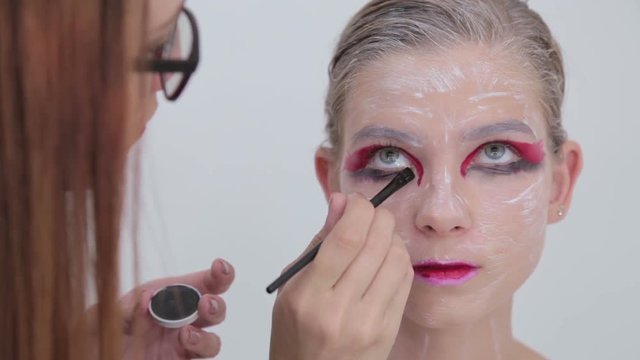 5 shots. Eye shadow painting: professional make-up artist making face makeup art. Make up, visage and fashion concept